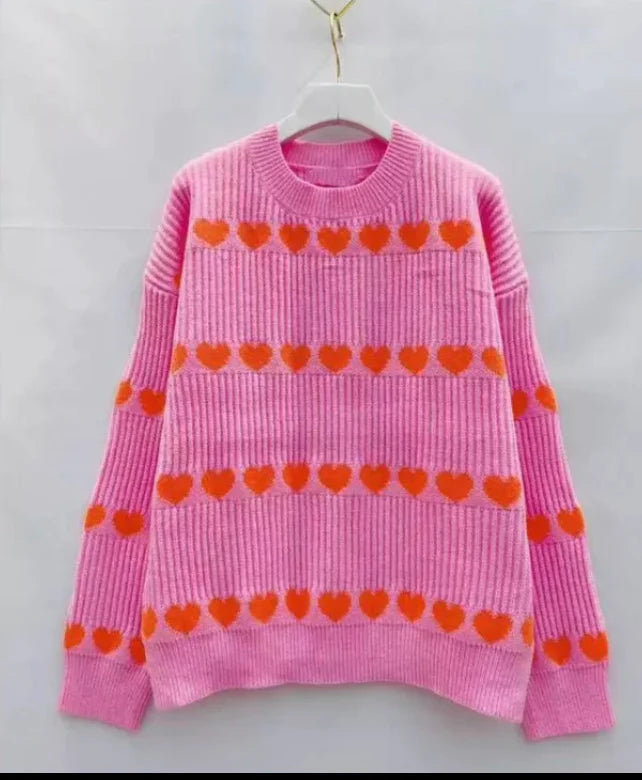 Roze trui met rode hartjes